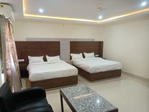 Hotel Rajwada palace客房内的一张或多张床位