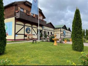 a building with a flag in front of it at Grüne Glocke in Altenau