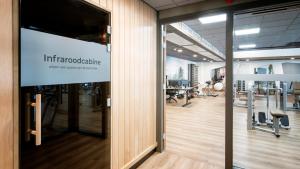 an open office with a sign on a wall at De Egmonden in Egmond aan Zee