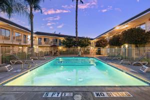 a swimming pool in front of a building at Motel 6-Temecula, CA - Historic Old Town in Temecula