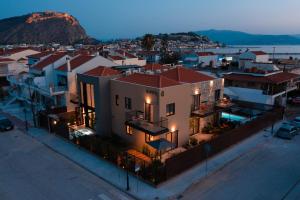 an aerial view of a city at night at Capital Luxury Suites in Nafplio