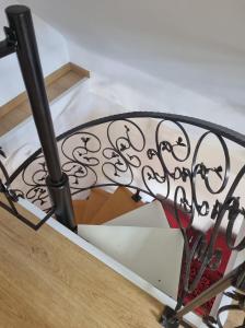 a metal railing on a staircase with a box at NA SKARPIE in Łomża +23 photos