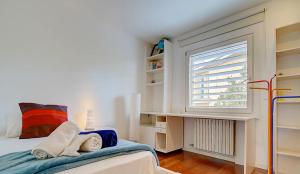 a bedroom with a bed and a window at VILLA BONANOVA STYLE in Palma de Mallorca +10 photos