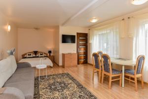 TV a/nebo společenská místnost v ubytování Apartamentų nuoma