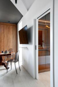 a dining room with a table and a sliding glass door at Partnerapart Rakowicka 14 Kamienica in Krakow