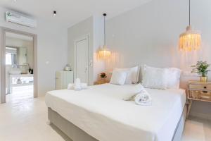 Krevet ili kreveti u jedinici u okviru objekta Hesperides Hotel Pefkochori