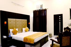 Katil atau katil-katil dalam bilik di Taraji Resort