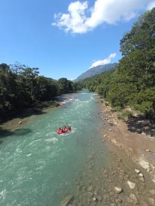 a group of people in a boat on the river at Room in Cabin - Rafting Hut by The River in Lanquín
