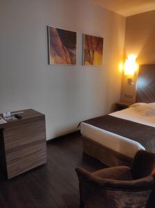 Postel nebo postele na pokoji v ubytování Hotel Aroi Ponferrada