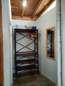 a room with a wooden shelf in a wall at Mancora Beach House in Máncora