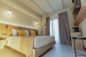Metis Urbane Living Spaces tesisinde bir odada yatak veya yataklar