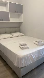 A bed or beds in a room at Acropolis Gem by GHH