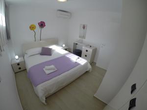 Postel nebo postele na pokoji v ubytování Villa Leona