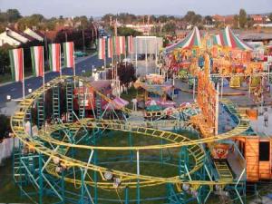 an amusement park with a roller coaster and rides at Holiday home Balatonlelle/Balaton 19095 in Balatonlelle