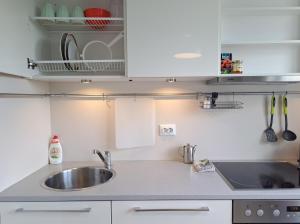 a kitchen with a sink and a counter top at Volvi Apartment in Tallinn