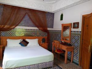 Ένα ή περισσότερα κρεβάτια σε δωμάτιο στο Malabata Guest House