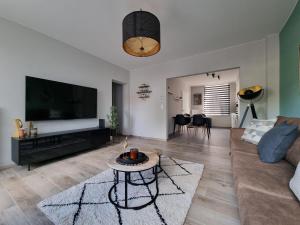 Setusvæði á Appartement cosy et familial avec terrasse