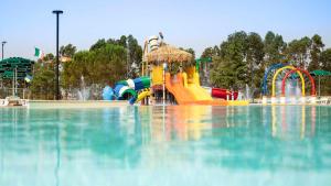 a water park with a pool of water at Casa in Maremma Tuscany Village in Scarlino