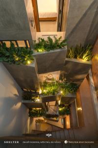 an overhead view of a building with potted plants at Shelter Stay Da Nang in Da Nang