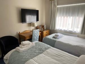 Postel nebo postele na pokoji v ubytování Avonbridge Hotel