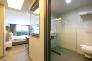 a bathroom with a shower and a toilet at URLA PERA HOTEL in Urla +61 photos