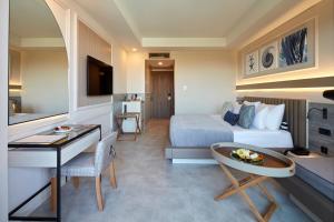 a hotel room with a bed and a desk at Liu Resorts in Side