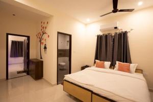 Tempat tidur dalam kamar di Thiru Pavilion Retreat