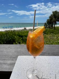 a drink sitting on a table with an orange slice at The Flip Flop - UPDATED vacation home! in Naples