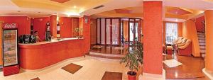 a lobby of a restaurant with a bar and a restaurant at HOTEL PHILOXENIA in Eforie Nord