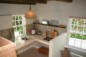 Virtuvė arba virtuvėlė apgyvendinimo įstaigoje The Cottage on 55
