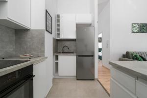 Kuchyňa alebo kuchynka v ubytovaní Exclusive Apartment Kajdasza Wroclaw by Noclegi Renters