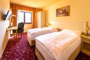 En eller flere senger på et rom på Spa Hotel Vita