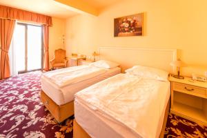 En eller flere senger på et rom på Spa Hotel Vita