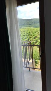 a view of a balcony from a room with a window at La Foresteria in Galşa