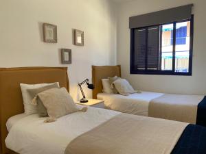Katil atau katil-katil dalam bilik di Fantastico Duplex en Meloneras
