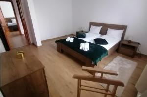 Postel nebo postele na pokoji v ubytování Lotus Apartman II