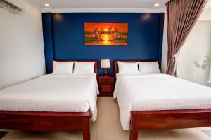 Letto o letti in una camera di Mad Monkey Hostel Siem Reap