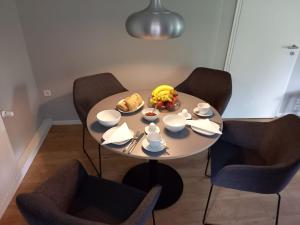 a small table with a plate of food on it at THE IVY in Wittingen