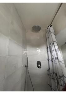 a shower with a shower curtain in a bathroom at Amalfi Coast Casa Ida in Vietri sul Mare +17 photos