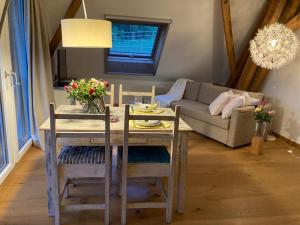 a living room with a table and a couch at Ferienwohnung Burg Murten in Murten