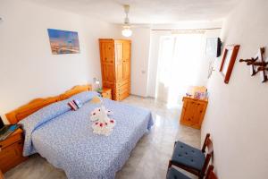 Postel nebo postele na pokoji v ubytování Hotel Casa Adolfo Ischia