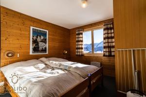 Postel nebo postele na pokoji v ubytování Chalet Lärchenwinkel, Riederalp Golmenegg