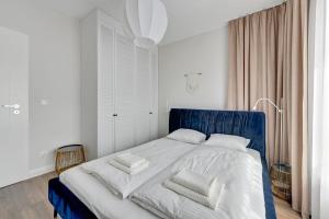 Posteľ alebo postele v izbe v ubytovaní Gdańsk Comfort Apartaments Łąkowa