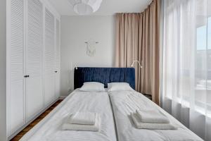Posteľ alebo postele v izbe v ubytovaní Gdańsk Comfort Apartaments Łąkowa