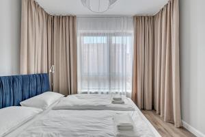 Posteľ alebo postele v izbe v ubytovaní Gdańsk Comfort Apartaments Łąkowa