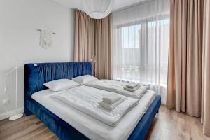 Posteľ alebo postele v izbe v ubytovaní Gdańsk Comfort Apartaments Łąkowa