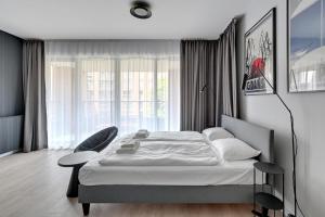 Posteľ alebo postele v izbe v ubytovaní Gdańsk Comfort Apartaments Łąkowa