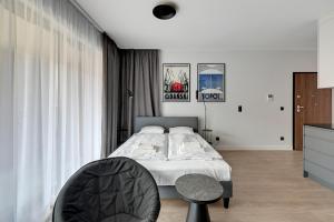 Posteľ alebo postele v izbe v ubytovaní Gdańsk Comfort Apartaments Łąkowa