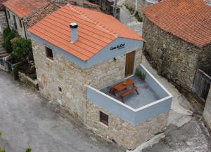 an overhead view of a building with a table on the balcony at Casa do Eirô in Pinheiro