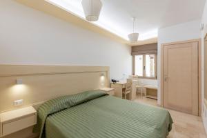 Postel nebo postele na pokoji v ubytování Hotel San Francisco